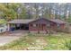 Brick ranch house with carport and landscaping at 2314 Omaha Sw Rd, Atlanta, GA 30331