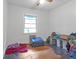 Small bedroom with hardwood floors and a window at 2314 Omaha Sw Rd, Atlanta, GA 30331