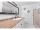 Bathroom with a vanity, shower/tub combo, and white tile at 2314 Omaha Sw Rd, Atlanta, GA 30331