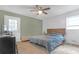 Bedroom with a queen-size bed, a ceiling fan, and access to the outside at 2314 Omaha Sw Rd, Atlanta, GA 30331