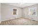 Bright bedroom with neutral carpeting and large windows at 2435 Wood Valley Dr, Atlanta, GA 30344