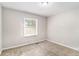 Spacious bedroom with neutral wall paint and plush carpeting at 2435 Wood Valley Dr, Atlanta, GA 30344