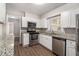 Renovated kitchen features granite countertops and stainless steel appliances at 2435 Wood Valley Dr, Atlanta, GA 30344