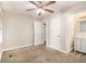 Bright bedroom with ceiling fan and access to bathroom at 3449 Misty Valley Rd, Decatur, GA 30032