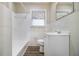 Clean bathroom with white tile, bathtub, and vanity at 3449 Misty Valley Rd, Decatur, GA 30032