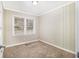 Bright bedroom featuring neutral walls and carpet at 3449 Misty Valley Rd, Decatur, GA 30032