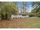 Gray ranch house with red door and carport at 3449 Misty Valley Rd, Decatur, GA 30032
