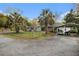 House exterior with carport and fenced yard at 520 Mcdonough Rd, Hampton, GA 30228