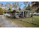 Brick house exterior with a screened porch and fenced yard at 520 Mcdonough Rd, Hampton, GA 30228