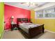 Bedroom with wood sleigh bed, and colorful painted walls at 520 Mcdonough Rd, Hampton, GA 30228