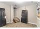 Unfinished basement with carpeted floor and access to stairs at 1870 S Columbia Pl, Decatur, GA 30032