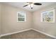 Bright bedroom with two windows and ceiling fan at 1870 S Columbia Pl, Decatur, GA 30032