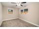 Spacious bedroom with neutral walls, new carpet, and ceiling fan at 1870 S Columbia Pl, Decatur, GA 30032