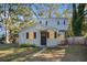 Two-story house with gray siding, updated windows, and a small front yard at 1870 S Columbia Pl, Decatur, GA 30032