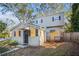 Two-story house with gray siding, updated windows, and a small deck at 1870 S Columbia Pl, Decatur, GA 30032