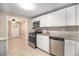 Modern kitchen with white cabinets, granite countertops, and stainless steel appliances at 1870 S Columbia Pl, Decatur, GA 30032