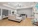 Living room features L-shaped sectional, hardwood floors, and a modern fireplace at 1973 Glendale Dr, Decatur, GA 30032