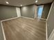 Finished basement with gray walls and light brown vinyl flooring at 3078 Michael Sw Dr, Marietta, GA 30060