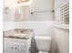 Clean bathroom featuring granite countertop and white tile at 2604 Harmony Way, Atlanta, GA 30344