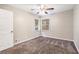 Well-lit bedroom with neutral walls and carpet flooring at 2604 Harmony Way, Atlanta, GA 30344