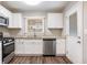 Modern kitchen with white shaker cabinets and granite countertops at 2604 Harmony Way, Atlanta, GA 30344