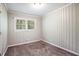 Simple bedroom with carpet flooring and neutral wall decor at 2604 Harmony Way, Atlanta, GA 30344