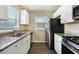 Kitchen with granite countertops and stainless steel appliances at 2910 Delowe Dr, Atlanta, GA 30344