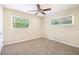 Well-lit bedroom featuring carpet flooring and ceiling fan at 2910 Delowe Dr, Atlanta, GA 30344