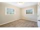 Spacious bedroom with neutral walls, carpet flooring and two windows at 2910 Delowe Dr, Atlanta, GA 30344