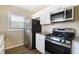 Kitchen features stainless steel appliances and granite countertops at 2910 Delowe Dr, Atlanta, GA 30344