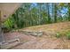 Brick patio with view of wooded backyard at 2910 Delowe Dr, Atlanta, GA 30344