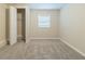 Bright bedroom featuring neutral walls, carpet, and closet at 61 Hardy Cir, Dallas, GA 30157