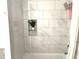 Shower and bathtub with marble-look tile at 2479 Peachtree Ne Rd # 105, Atlanta, GA 30305