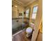 Bathroom with walk-in shower, toilet and updated flooring at 6340 Koweta Rd, Fairburn, GA 30213