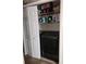 Convenient laundry closet with washer, dryer, and storage shelves at 6340 Koweta Rd, Fairburn, GA 30213