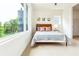 Bedroom with a queen bed, hardwood floors, and large window with a view at 1641 Mcnaught Dr # 35, Atlanta, GA 30317