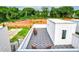 Aerial view of rooftop decks with gray composite decking and wicker chairs at 1641 Mcnaught Dr # 35, Atlanta, GA 30317