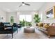 Relaxing living room with leather sofa, armchairs, and sliding glass doors to a balcony at 1641 Mcnaught Dr # 35, Atlanta, GA 30317