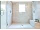 Large walk-in shower with double shower heads and a built-in seat at 1641 Mcnaught Dr # 35, Atlanta, GA 30317
