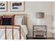Nightstand with modern lamp and books at 1641 Mcnaught Dr # 35, Atlanta, GA 30317