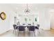 Elegant dining room with a modern light fixture and seating for six at 1641 Mcnaught Dr # 35, Atlanta, GA 30317