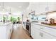 Modern kitchen with white cabinets, stainless steel appliances, and an open layout at 1641 Mcnaught Dr # 35, Atlanta, GA 30317