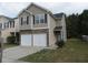 Two-story townhouse with double garage at 6511 Grey Fox Way, Riverdale, GA 30296