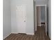 Bedroom with neutral walls, wood floors, and a closet at 6511 Grey Fox Way, Riverdale, GA 30296