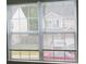 View from window of neighboring houses and street at 6511 Grey Fox Way, Riverdale, GA 30296