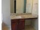 Bathroom vanity with granite countertop and wood cabinets at 6511 Grey Fox Way, Riverdale, GA 30296