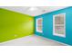 Bright bedroom with lime and teal walls at 226 Graymist Ln, Loganville, GA 30052