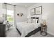 Bedroom with a queen-size bed, gray carpet, and neutral decor at 3804 Commodore Ct, Buford, GA 30519