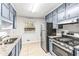 Kitchen with granite countertops and gray cabinets at 3959 Wabash Ln, Ellenwood, GA 30294