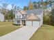 Two-story house with stone accents, double garage, and landscaped lawn at 139 Mary Hill Way, Douglasville, GA 30134